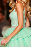 Robe courte de bal en tulle vert scintillant à volants