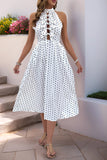 Robe d’été dos nu à pois noirs blancs avec nœud