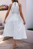 Robe d’été dos nu à pois noirs blancs avec nœud