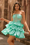 Robe de cocktail verte trapèze bustier à volants et perles avec nœud