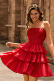 Robe de cocktail verte trapèze bustier à volants et perles avec nœud