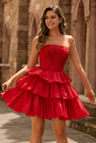 Robe de cocktail verte trapèze bustier à volants et perles avec nœud