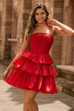 Robe de cocktail verte trapèze bustier à volants et perles avec nœud