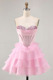 Robe de cocktail rose sans bretelles perlée à plusieurs niveaux