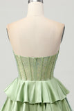 Robe de cocktail trapèze sans bretelles perlée vert foncé