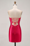 Robe de cocktail bustier découpée perlée fuchsia moulante