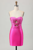 Robe de cocktail bustier découpée perlée fuchsia moulante