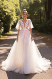 Robe de mariée demi-manches florales blanches une ligne