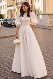 Robe de mariée à manches longues ivoire à manches longues