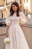 Robe de mariée à manches longues ivoire à manches longues