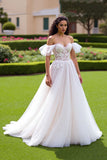 Robe de mariée à épaules dénudées ivoire une ligne appliquée