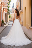 Robe de mariée plissée ivoire à col en V