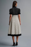 Robe vintage à volants à revers noir blanc à pois