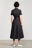 Robe noire à pois à col polo