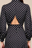 Noir à pois à manches longues Une robe
