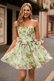 Robe de cocktail corset floral trapèze sans bretelles verte avec noeuds
