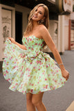 Robe de cocktail corset floral trapèze sans bretelles verte avec noeuds