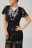 Robe noire à paillettes dorées des années 1920 avec franges
