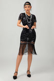 Robe noire à paillettes dorées des années 1920 avec franges