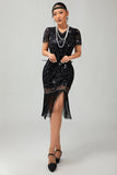 Robe noire à paillettes dorées des années 1920 avec franges