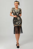 Robe noire à paillettes dorées des années 1920 avec franges