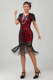 Robe noire à paillettes dorées des années 1920 avec franges
