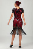 Robe noire à paillettes dorées des années 1920 avec franges