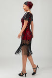 Robe noire à paillettes dorées des années 1920 avec franges