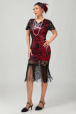 Robe noire à paillettes dorées des années 1920 avec franges