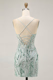 Robe de cocktail moulante aux alentours perlée verte avec lacets dans le dos