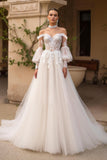 Robe de mariée ivoire à épaules dénudées en tulle avec manches