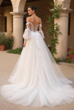 Robe de mariée ivoire à épaules dénudées en tulle avec manches