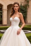 Robe de mariée trapèze bustier ivoire sans col en V