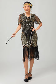 Robe moulante moulante à paillettes dorées noires des années 1920 avec pompons