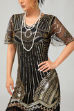 Robe moulante moulante à paillettes dorées noires des années 1920 avec pompons