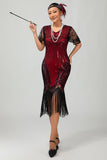 Robe moulante moulante à paillettes dorées noires des années 1920 avec pompons