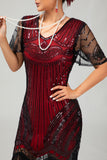 Robe moulante moulante à paillettes dorées noires des années 1920 avec pompons