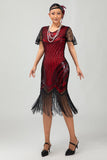 Robe moulante moulante à paillettes dorées noires des années 1920 avec pompons