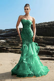 Robe de soirée bustier sirène à volants champagne et paillettes