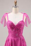 Robe de bal longue Burnot fleurie perlée en fuchsia avec dentelle dans le dos