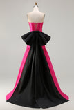 Robe de soirée longue en satin fuchsia coupe bustier à décolleté cabriolet avec grand nœud