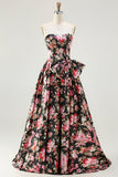 Robe longue de bal noire rose sans bretelles à motifs floraux avec nœud