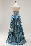 Robe de soirée longue trapèze bleu métallisé à corset ornée de perles