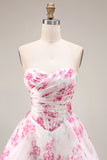 Robe de bal longue de bal en fleur fluminse blanche en fleur fûche fuchsia sans bretelles taille basque en ligne A