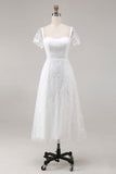 Robe de mariée midi en dentelle ivoire avec manches courtes
