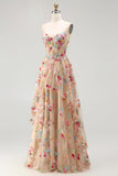 Robe de soirée longue ivoire ligne A bustier transparent brodée de fleurs avec fente et volants