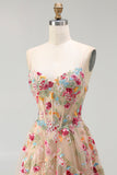 Robe de soirée longue ivoire ligne A bustier transparent brodée de fleurs avec fente et volants