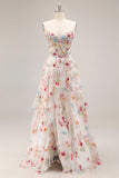 Robe de soirée longue ivoire ligne A bustier transparent brodée de fleurs avec fente et volants