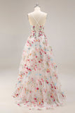 Robe de soirée longue ivoire ligne A bustier transparent brodée de fleurs avec fente et volants