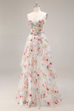 Robe de soirée longue ivoire ligne A bustier transparent brodée de fleurs avec fente et volants